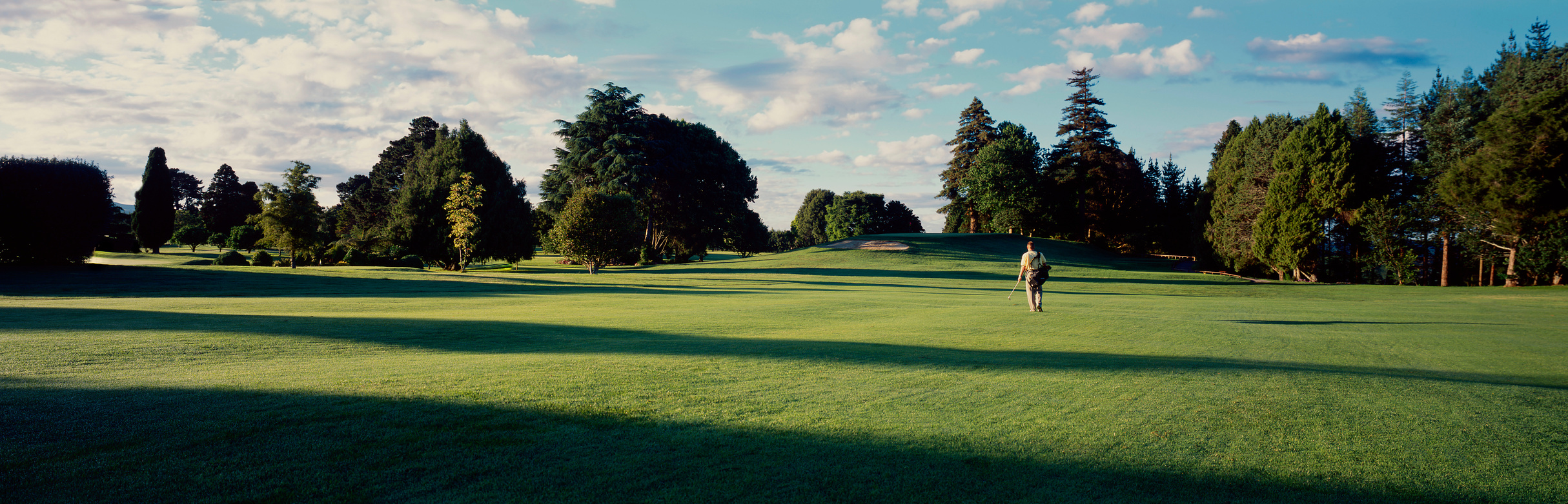 Golfer walking the fairway on a Utah golf course
